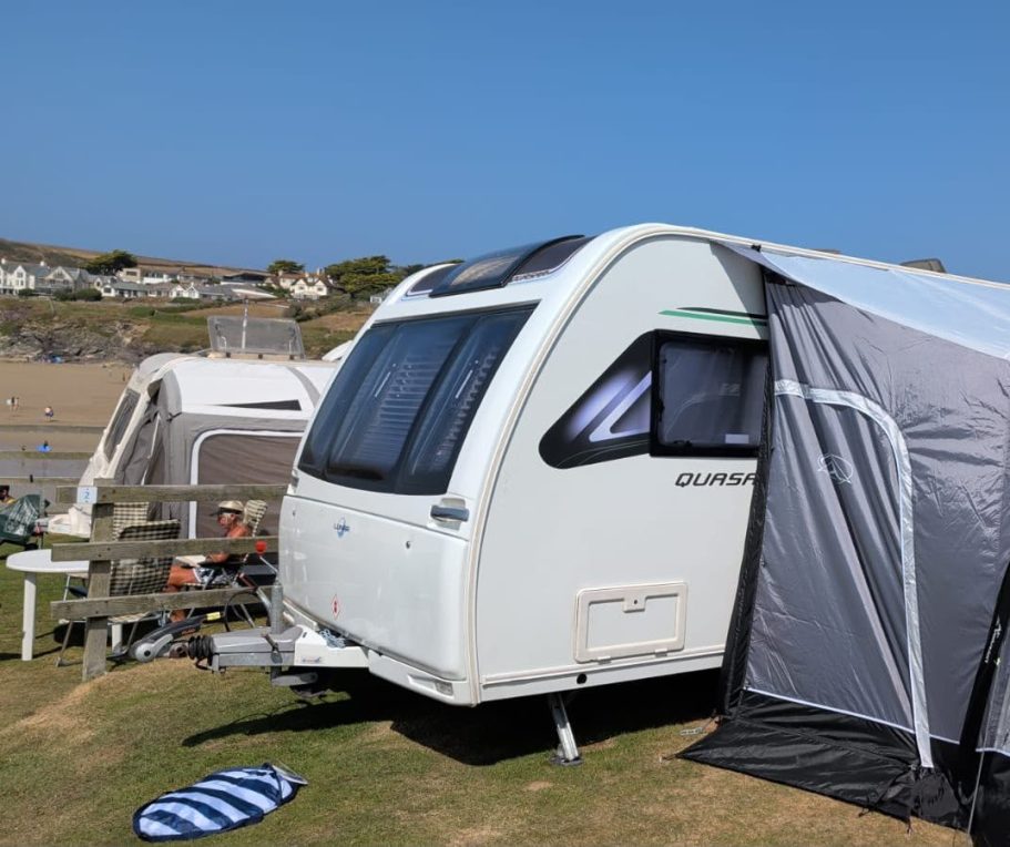 Caravan Hire with Awning SquaredAway rental caravan with awning set up on a seaside campsite.
